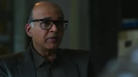 Still 5 of System (2026) WEB-DL [Hindi DD5.1] 4K 1080p 720p & 480p [x264/HEVC]