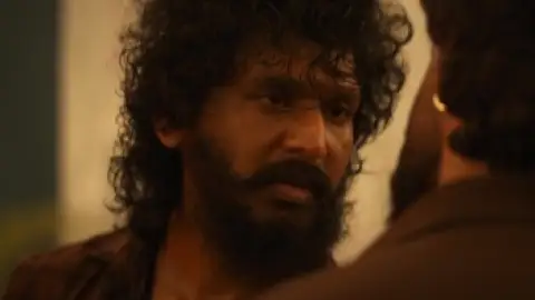 Still 1 of DC (2026) DS4K WEB-DL [Hindi (LiNE) & Tamil] 4K 1080p 720p & 480p Dual Audio [x264/10Bit-HEVC] | [DC: The Bloody Valentine]