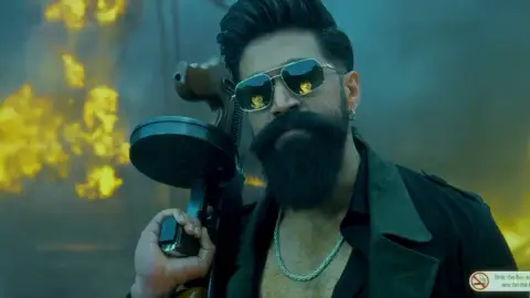 Still 2 of Toxic (2026) V2 HQ-HDTC [Hindi-Kannada-Tamil-Telugu] (LiNE) 1080p 720p & 480p Multi Audio [x264/HEVC]